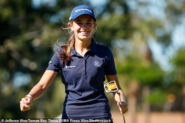 Kai Trump smiles while walking during her opening round at The ANNIKA presented by Gainbridge.