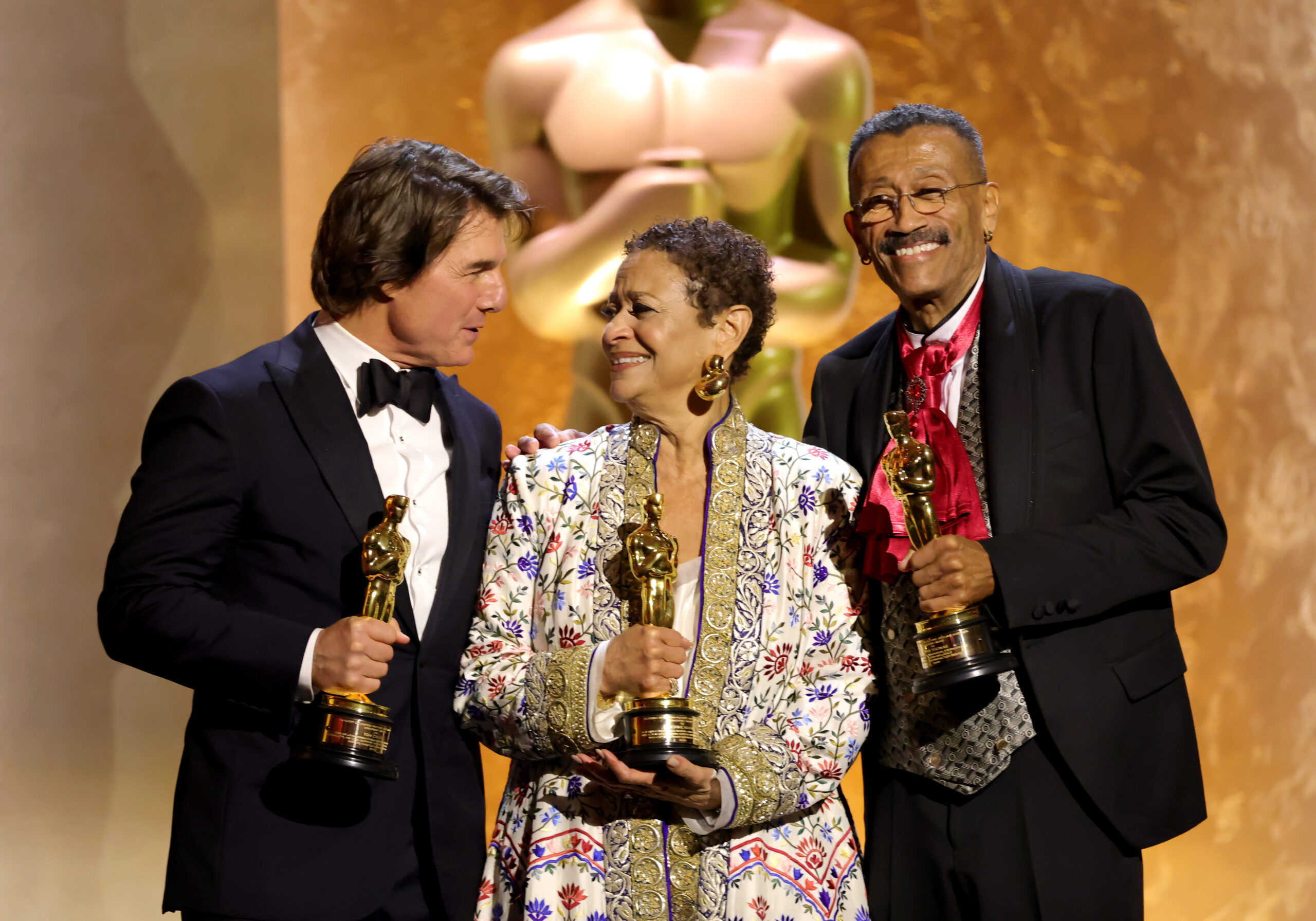 Tom Cruise, Debbie Allen and Wynn Thomas holding their honorary Oscars at the 2025 Governors Awards.