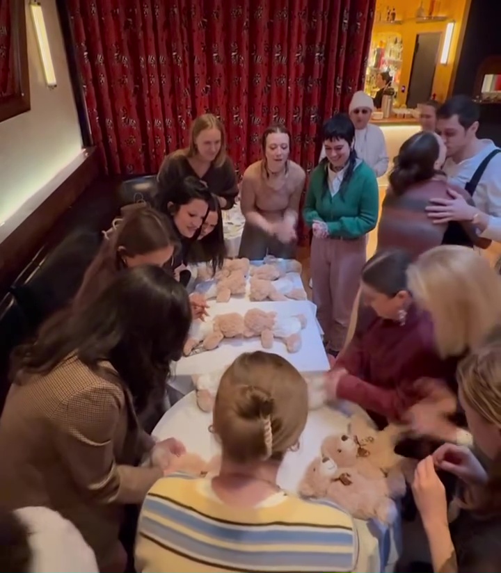 Pete Davidson kisses pregnant Elsie Hewitt during their bunny-themed baby shower as guests race to diaper teddy bears.