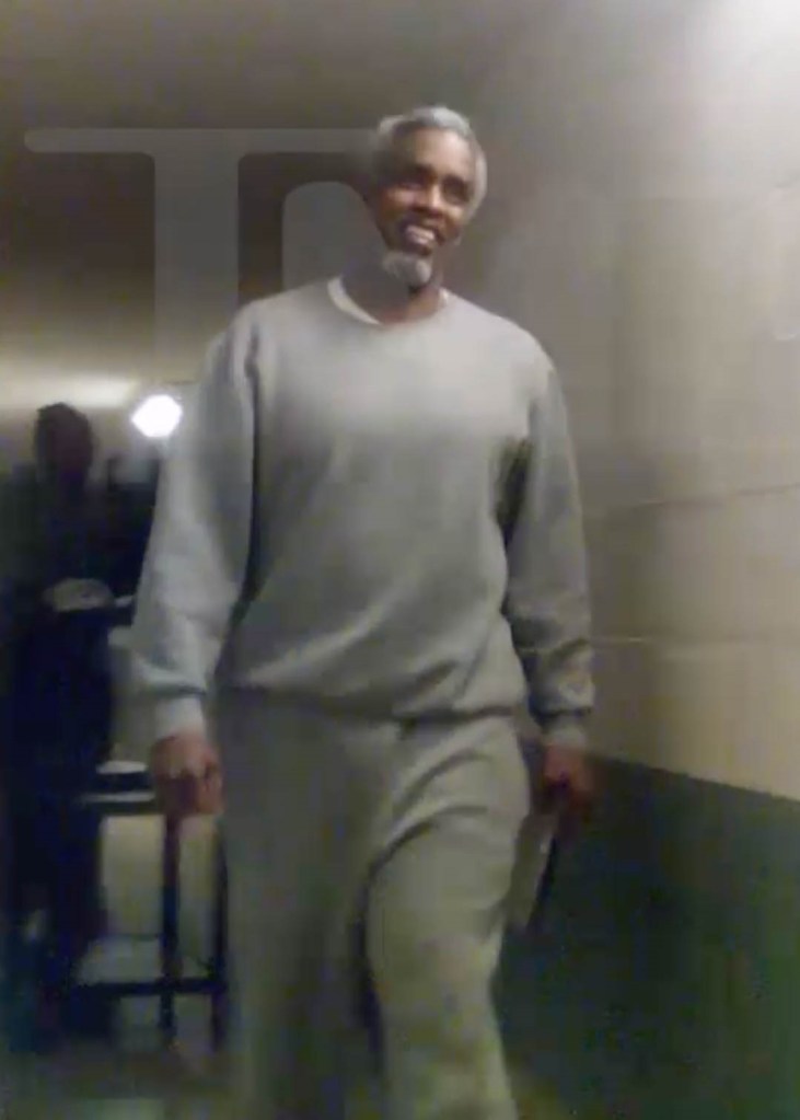 Sean "Diddy" Combs in a gray prison uniform at Fort Dix Federal Correctional Institution.