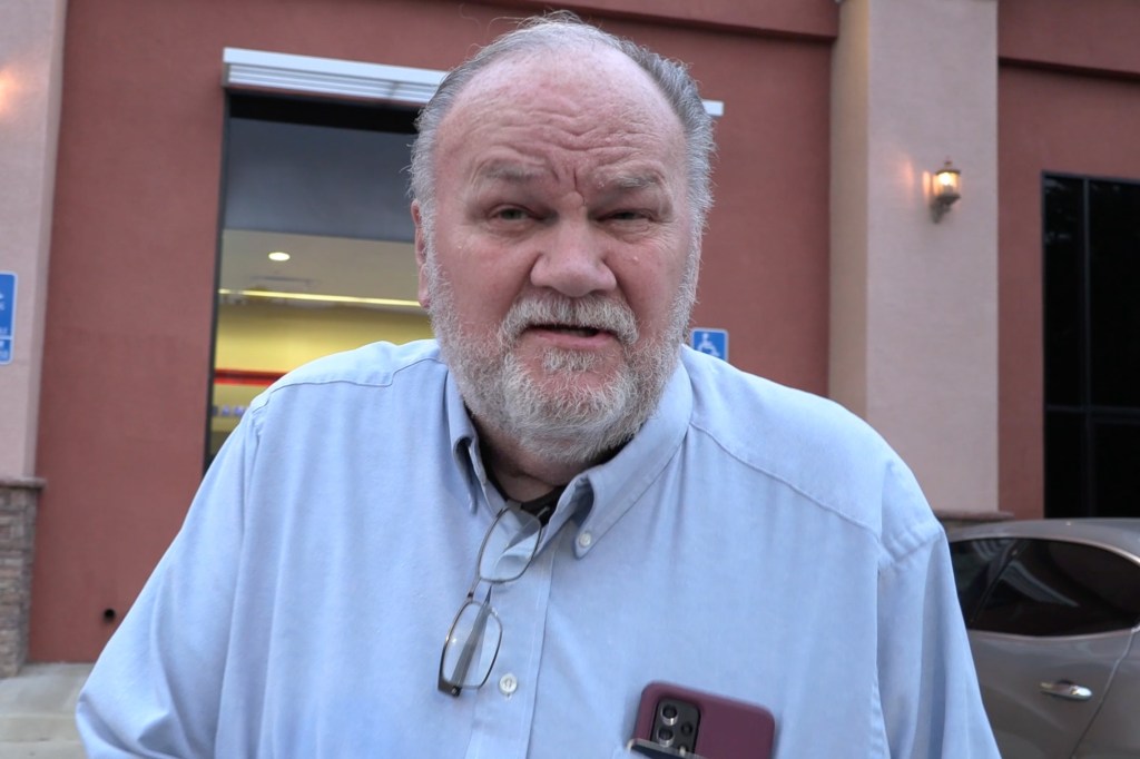 Thomas Markle in a light blue shirt with a phone and glasses in his pocket.