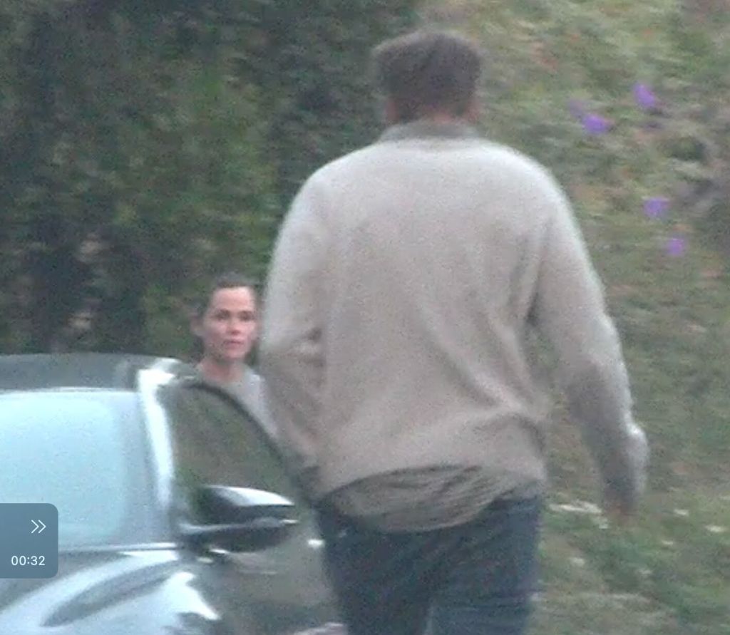 Jennifer Garner exchanging Christmas gifts with John Miller.
