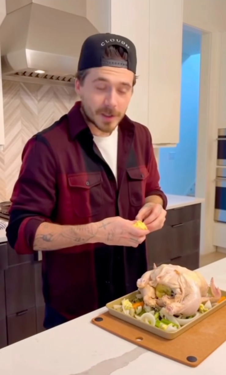 Brooklyn Beckham preparing to cook a roast chicken, discussing beer-brining.
