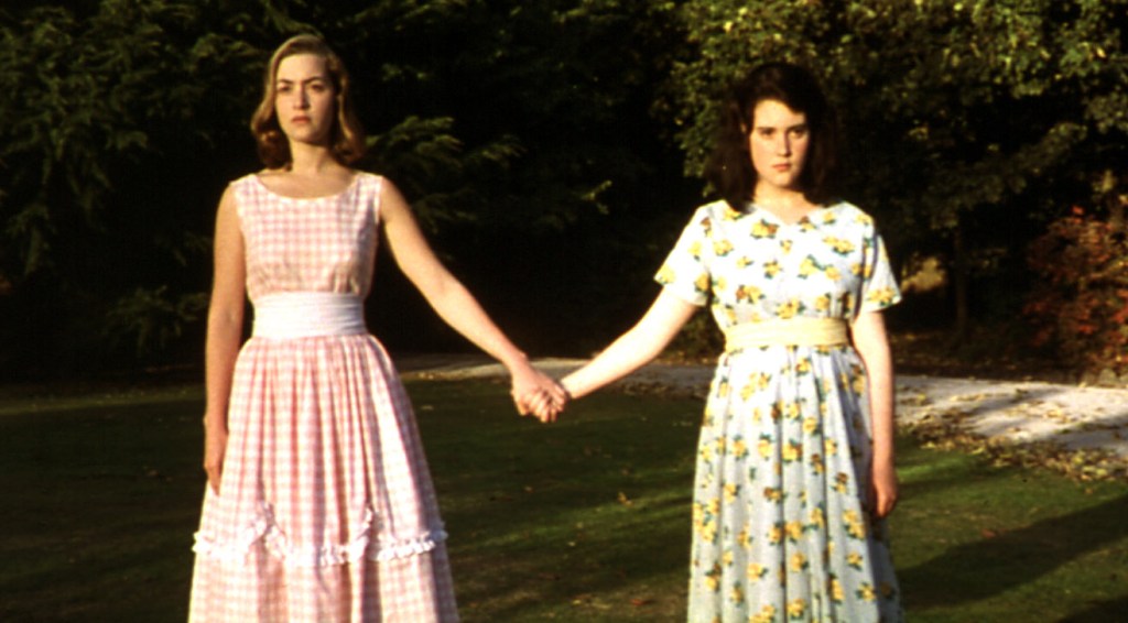 Kate Winslet and Melanie Lynskey hold hands in a scene from Heavenly Creatures (1994).