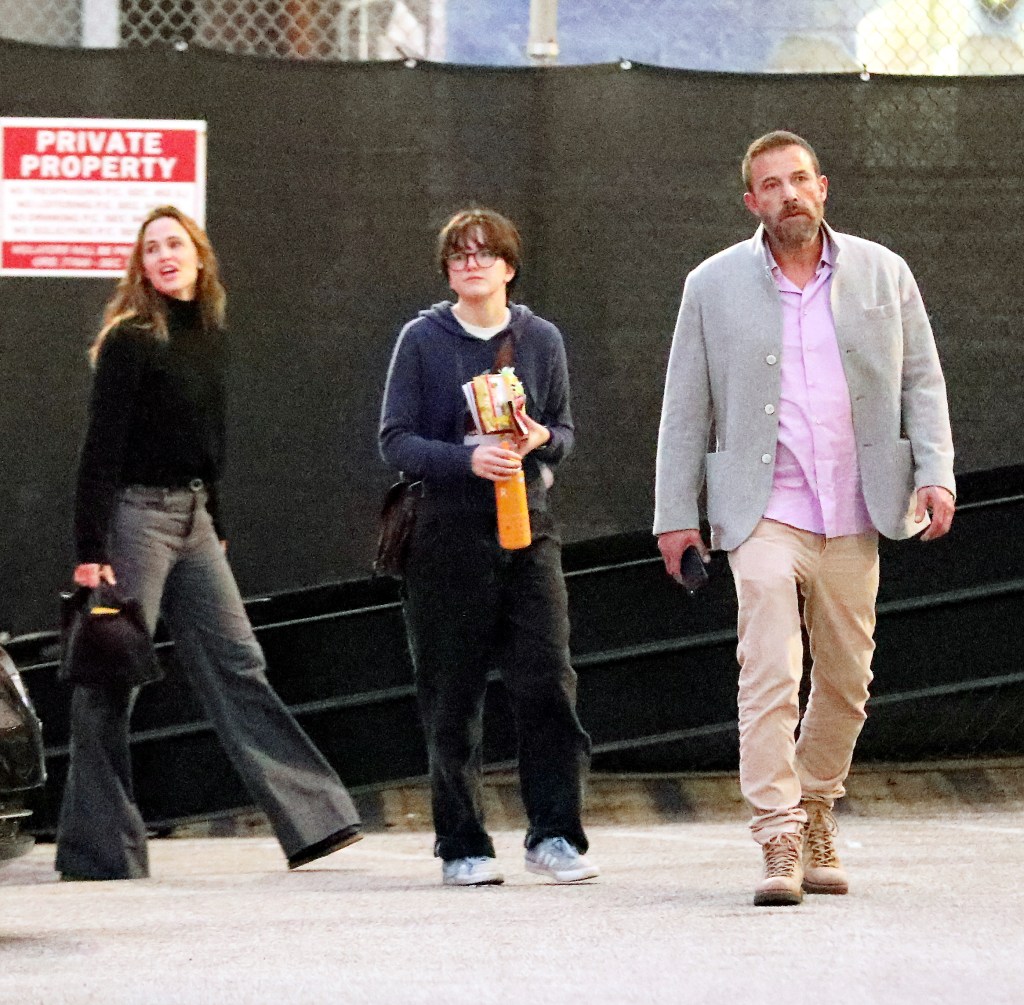 Jennifer Garner, Fin Affleck, and Ben Affleck walk outside the Pantages Theatre.