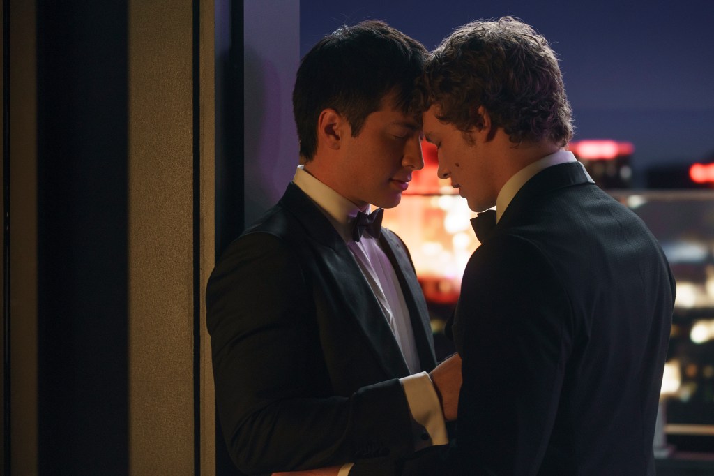 Press conference still of Hudson Williams and Connor Storrie from Heated Rivalry.