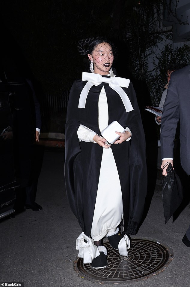 Audrey Nuna wearing slippers to Michael Braun's Golden Globes afterparty
