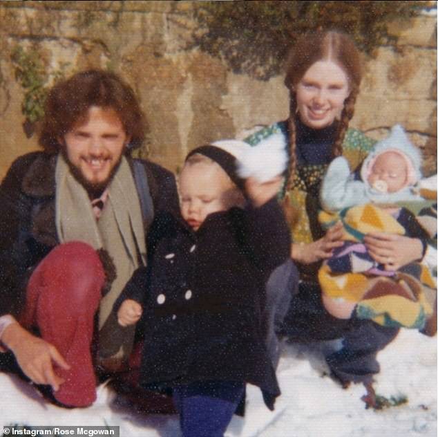 Rose McGowan becomes emotional on Paul C. Brunson's podcast when shown a childhood photo with her father, Daniel.