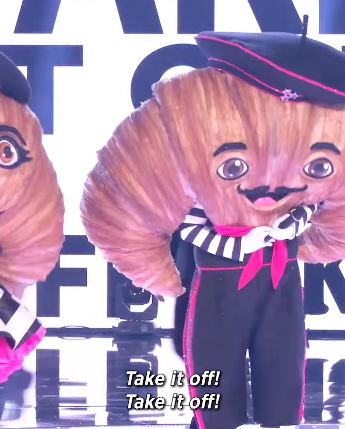 Todd and Julie Chrisley perform as The Croissants on The Masked Singer in striped, prison-inspired costumes.