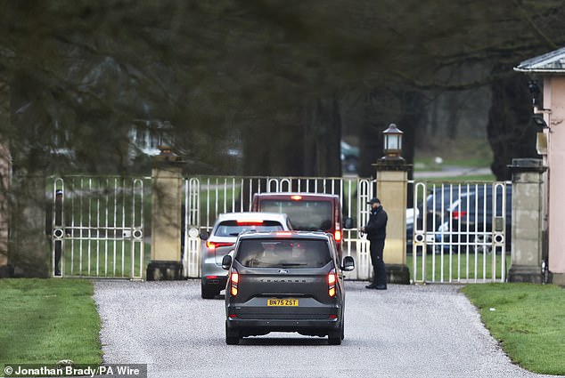 Police vans approach Royal Lodge in Windsor as searches continue following Andrew's arrest