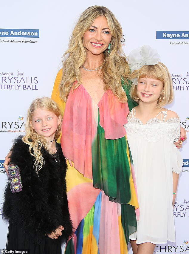 Eric Dane with daughters Billie and Georgia at a red-carpet event.