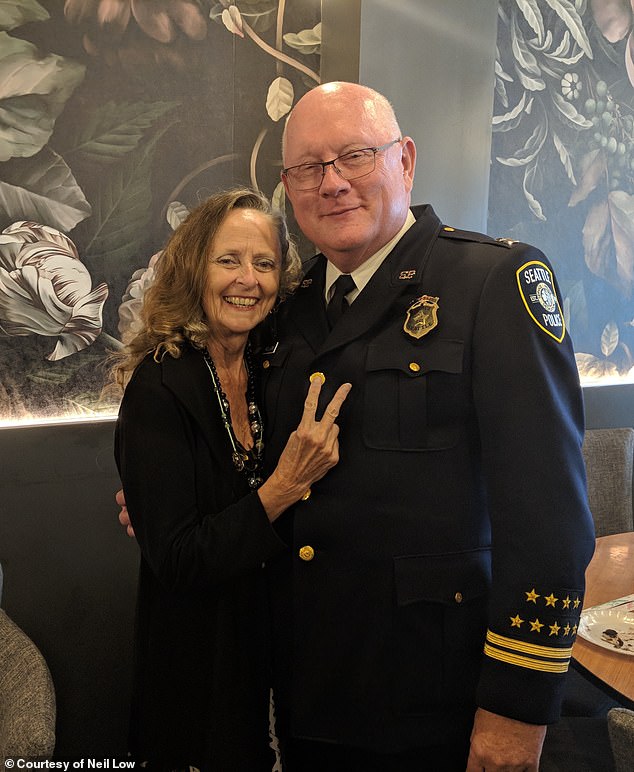 Retired Seattle Police captain Neil Low with his wife Leslie Brinkman at his 2018 retirement party.