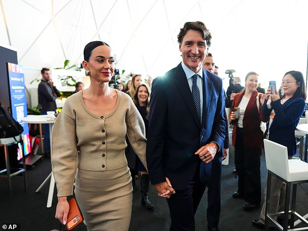 Justin Trudeau and Katy Perry leave an event at the World Economic Forum in Davos on January 20