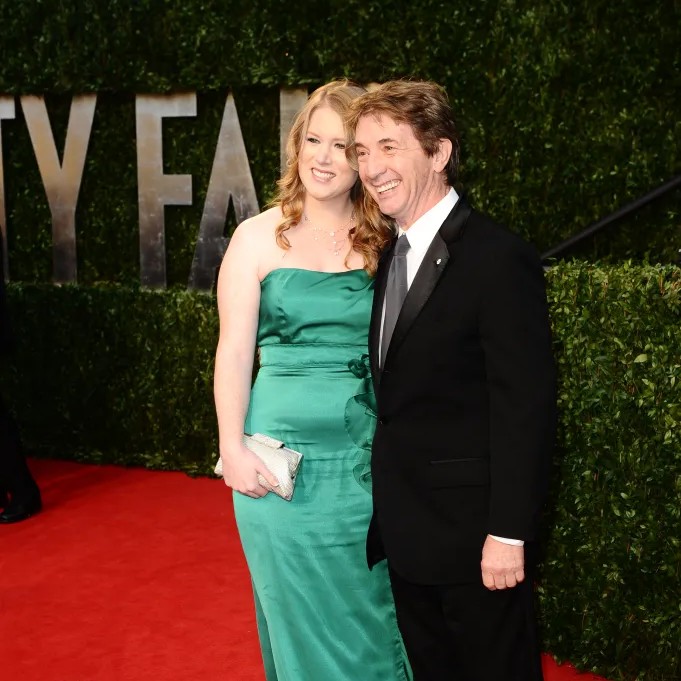 One of Katherine Short's neighbors said she gave "no indication of struggle" before she died by suicide on Monday. She's pictured here at the 2011 Vanity Fair Oscars Party with her dad, Martin Short. - Penske Media via Getty Images