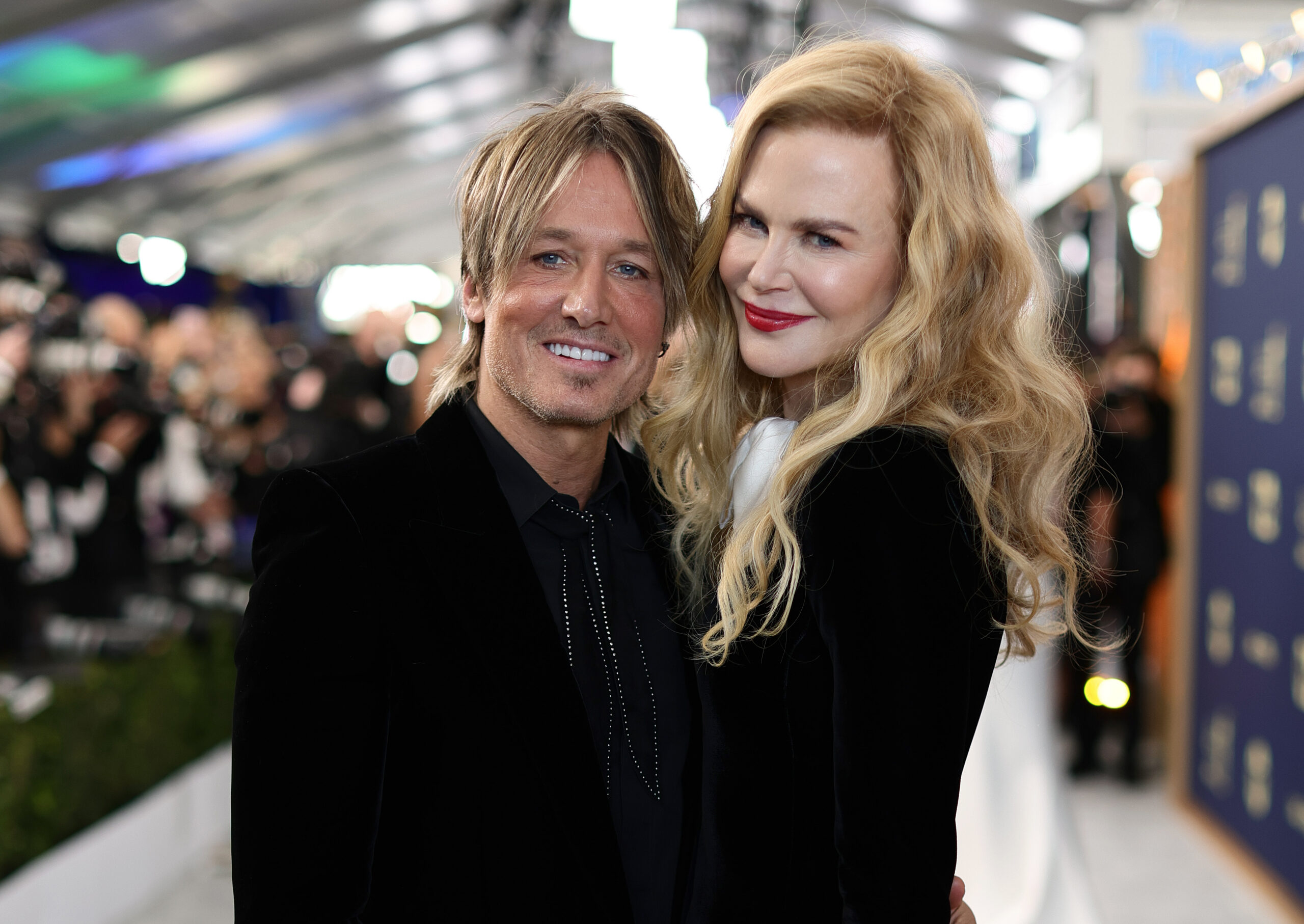 Nicole Kidman and Keith Urban pose together, smiling.