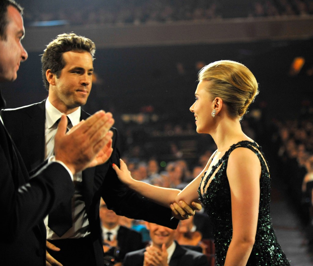 Ryan Reynolds and Scarlett Johansson seated together at an awards show.