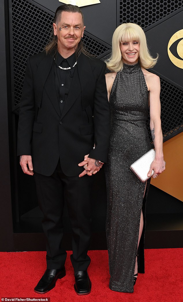 Kelly Osbourne with her mother, Sharon Osbourne, at a red carpet event.