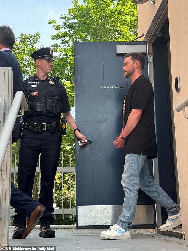 Justin Timberlake is led out in handcuffs following his June 2024 arrest in Sag Harbor, New York.
