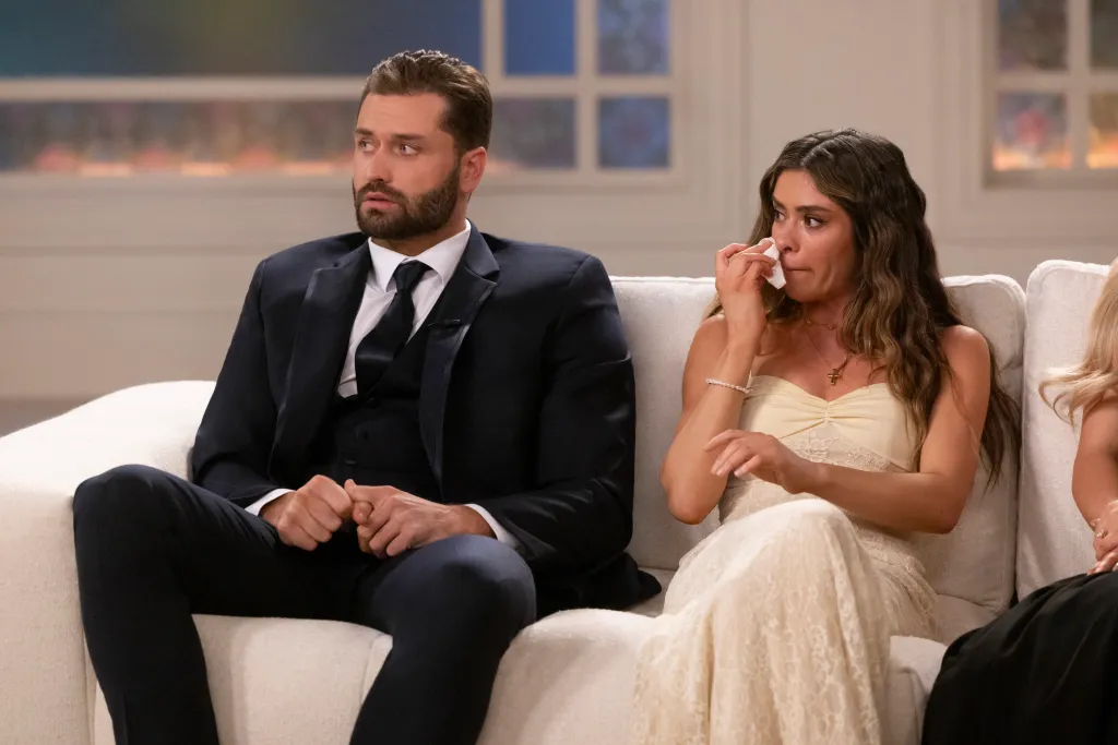 Taylor Frankie Paul and Dakota Mortensen seated together during a televised reunion special.
