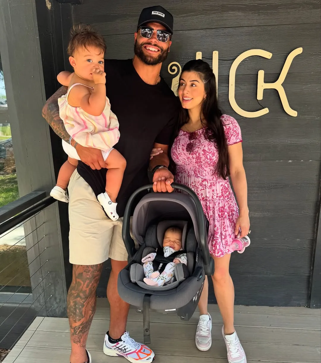 Dak Prescott and Sarah Jane Ramos with their two children, reflecting their focus on co-parenting.