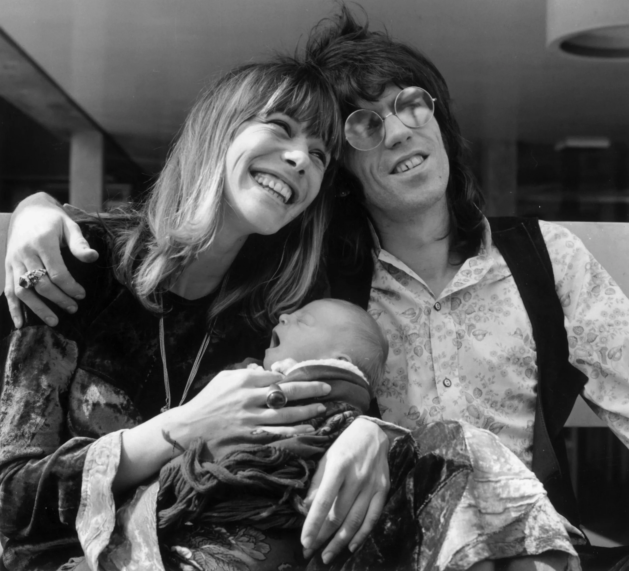 Keith Richards and Anita Pallenberg with their infant son Marlon outside King's College Hospital, London.