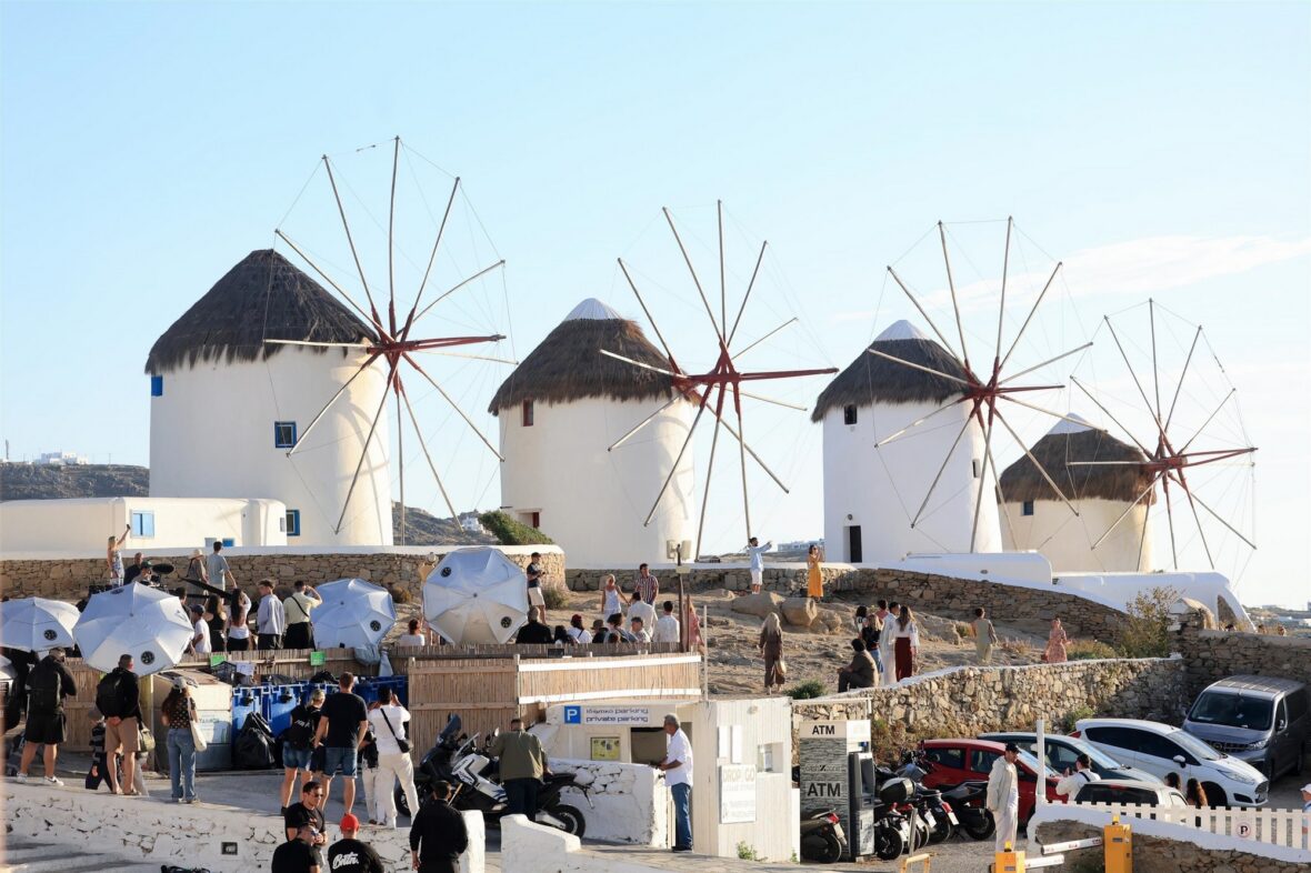 Fans gather near the iconic Mykonos windmills as Emily in Paris films its final season on location