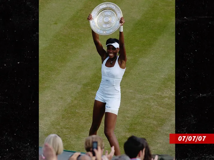 Venus Williams holding the Wimbledon trophy after a Grand Slam victory