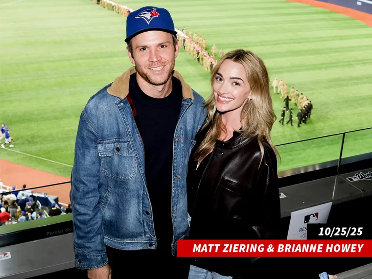 Brianne Howey and her husband Matt Ziering at a public event (Getty).