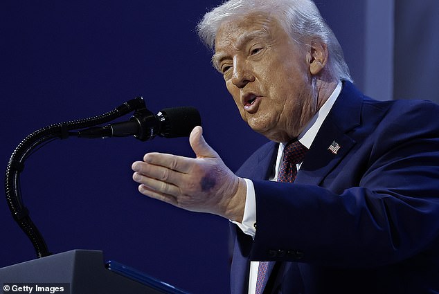 Trump speaks at a podium in Davos on January 22