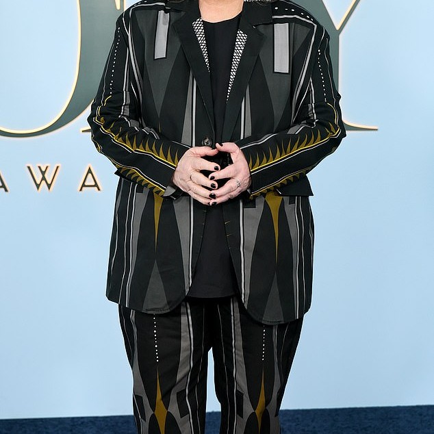 Rosie O'Donnell opted for a pair of black dress pants and a matching jacket over a simple black top. But the bizarre yellow and silver pattern totally ruined the look and made for a sartorial nightmare - Daily Mail