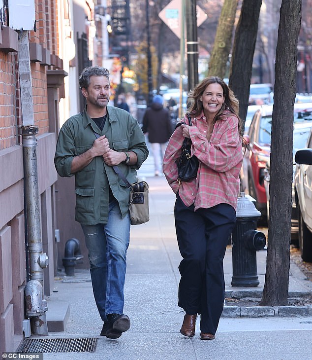 Katie Holmes and Joshua Jackson walk together on set in New York City while filming Happy Hours.