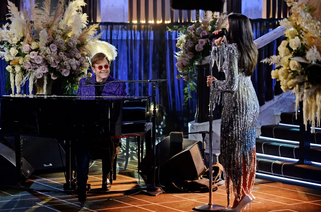Elton John at the piano with Dua Lipa singing, April 2021.