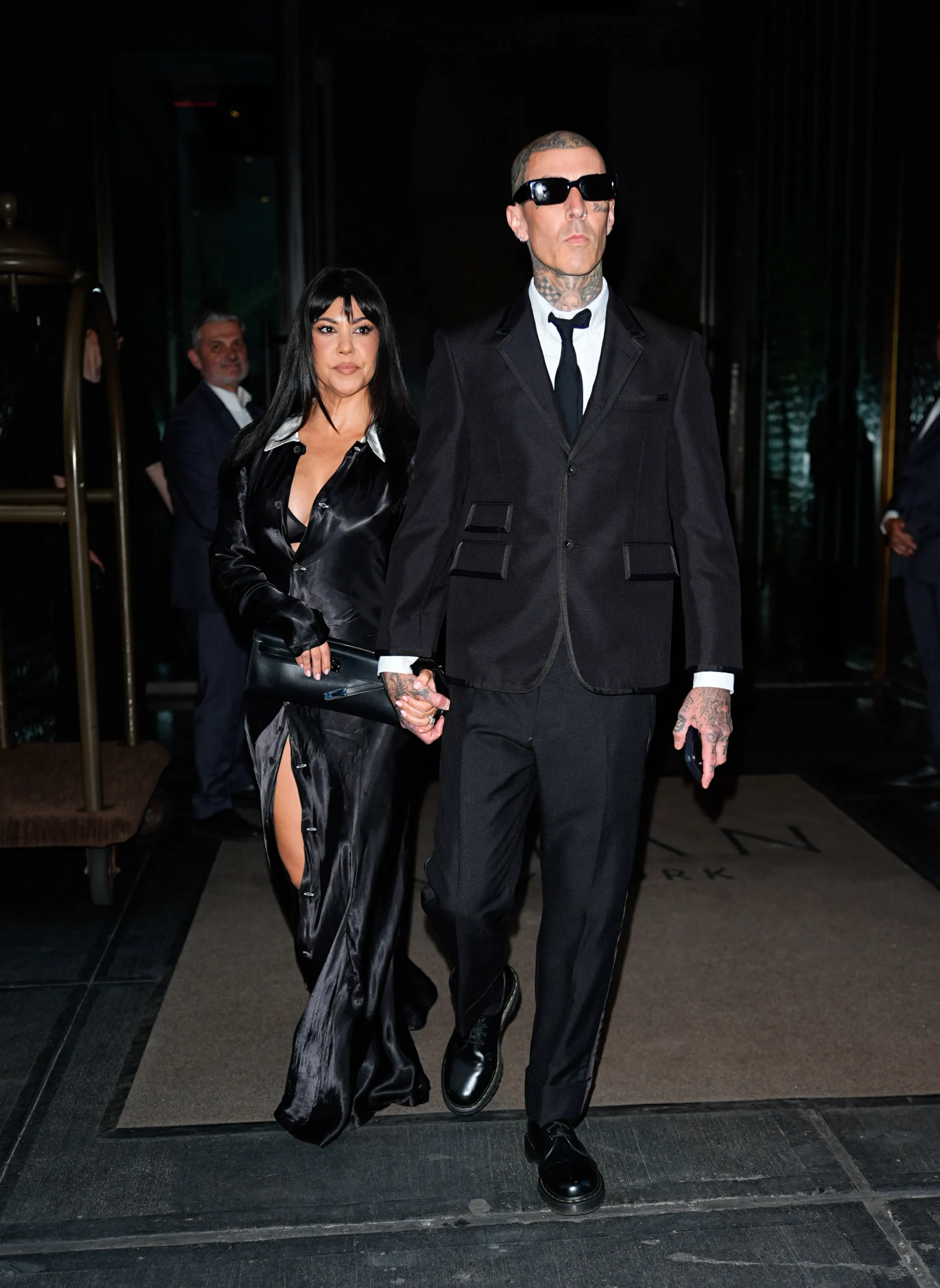Kourtney Kardashian and Travis Barker hold hands while walking in New York City during Tribeca.