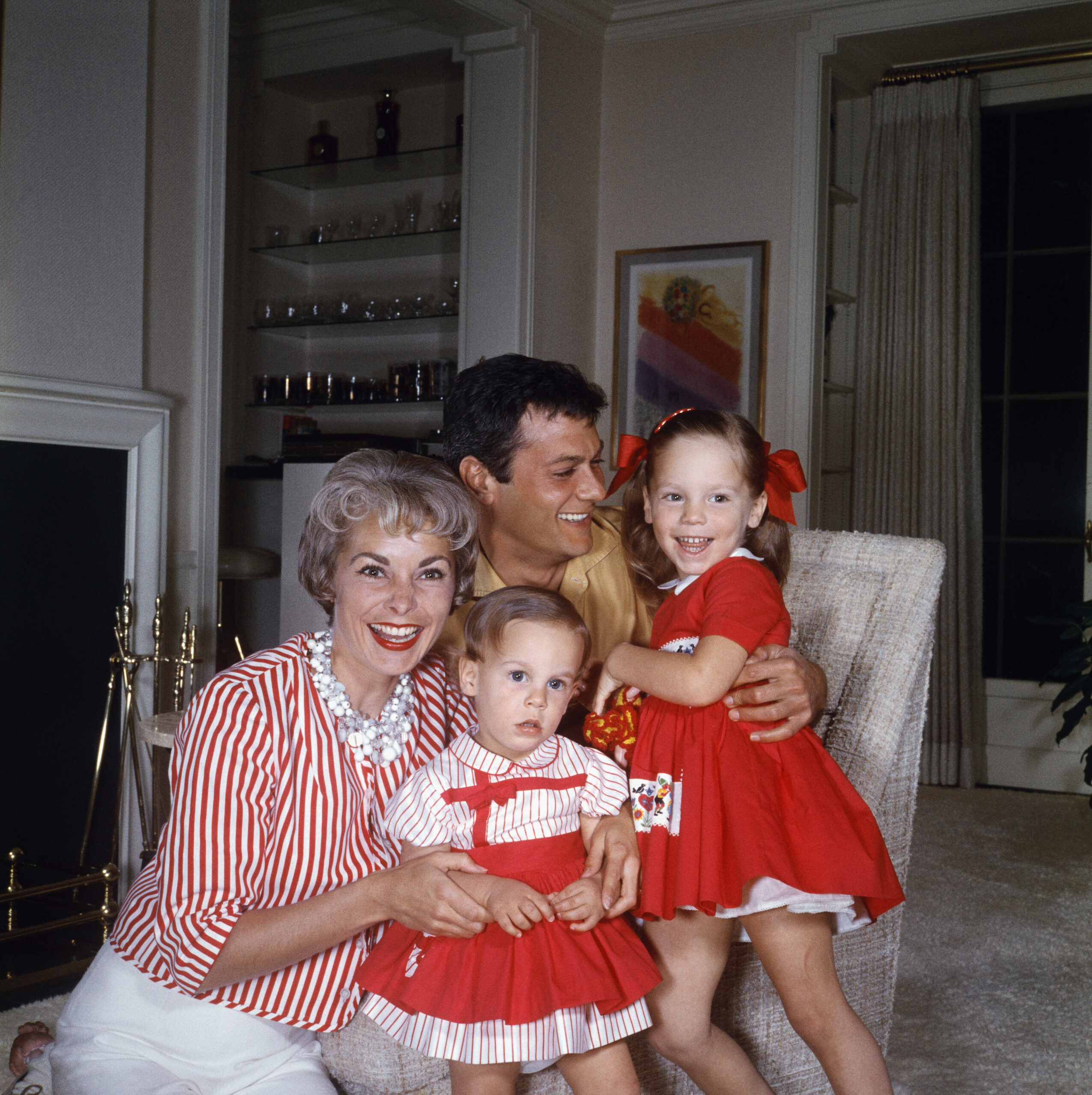 Janet Leigh and Tony Curtis with their daughters, Kelly Lee and Jamie Lee, at home.