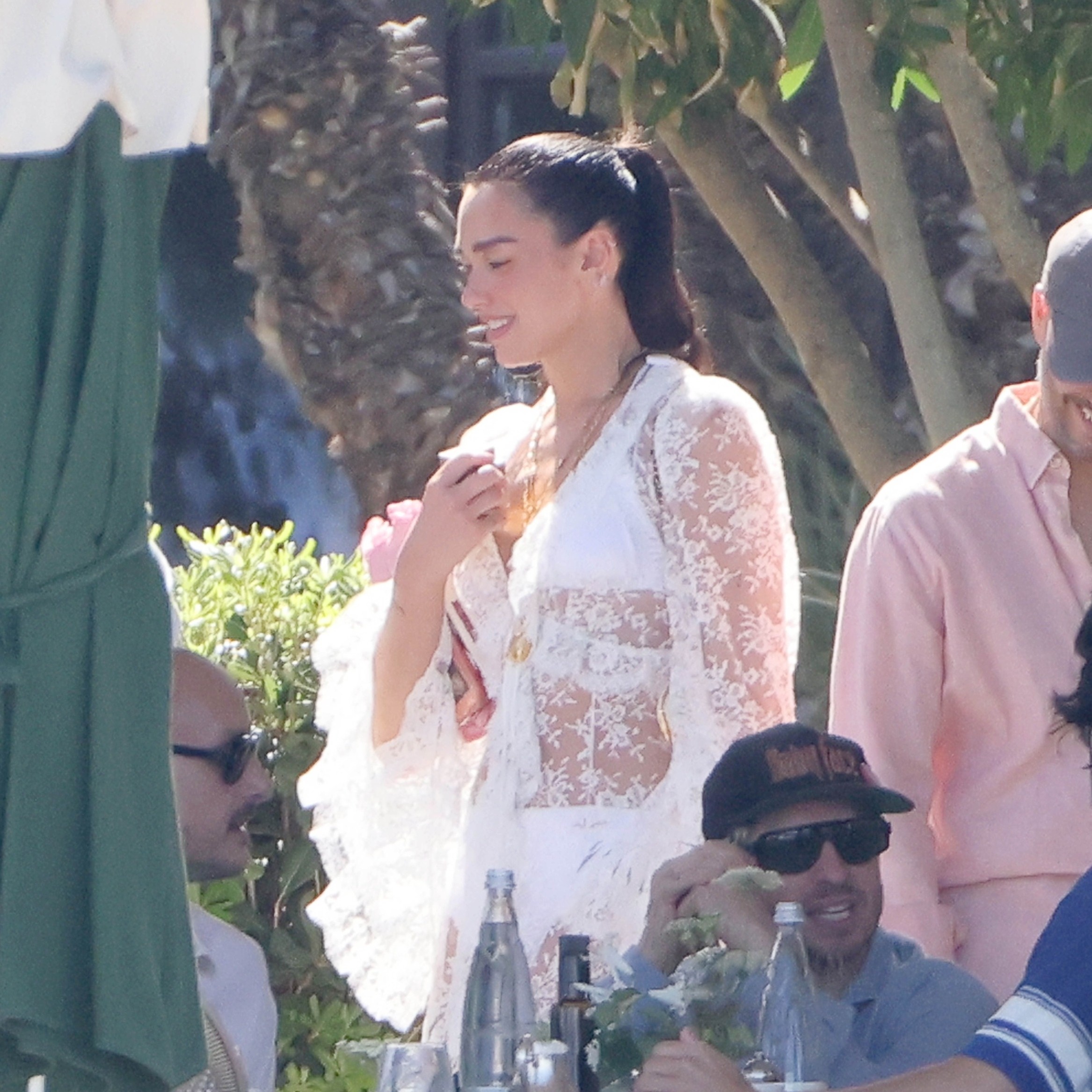 Dua Lipa glowed while continuing her wedding celebrations in Italy on Sunday. - Pino/COBRA TEAM / BACKGRID