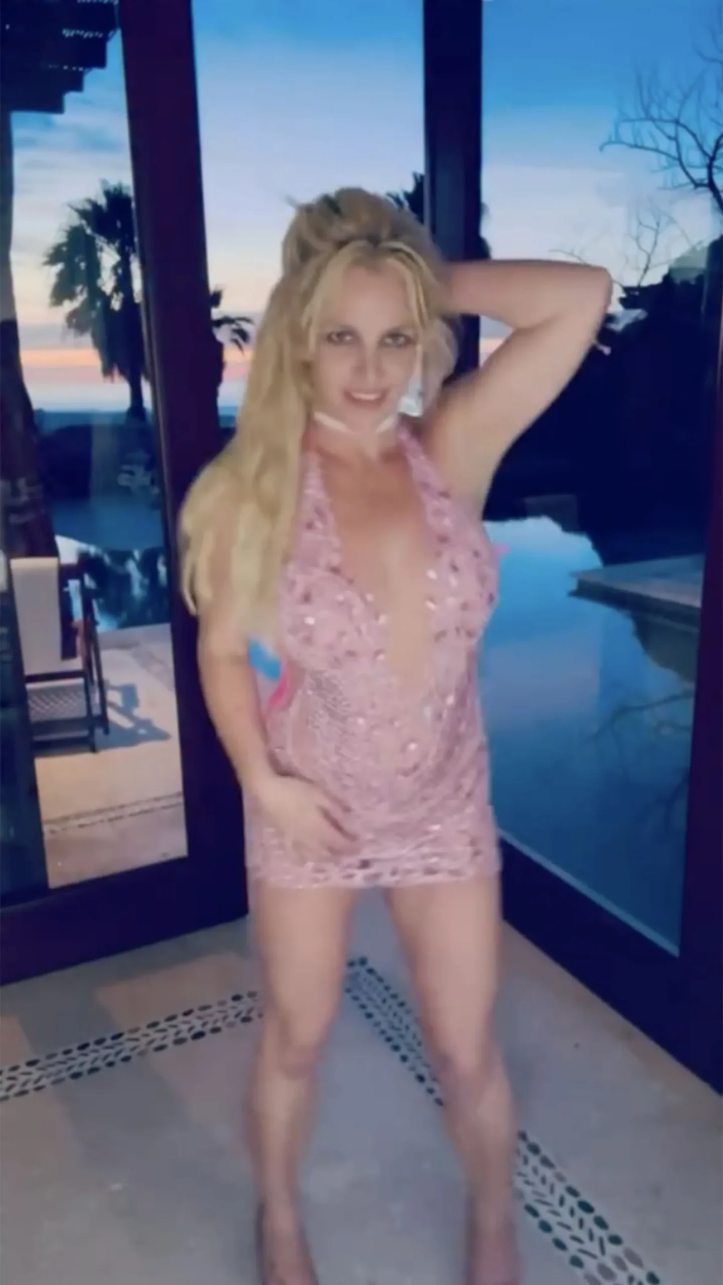 Britney Spears in a sparkly pink dress in a recent Instagram photo; she addressed 'mean girls' in a June 1 caption.