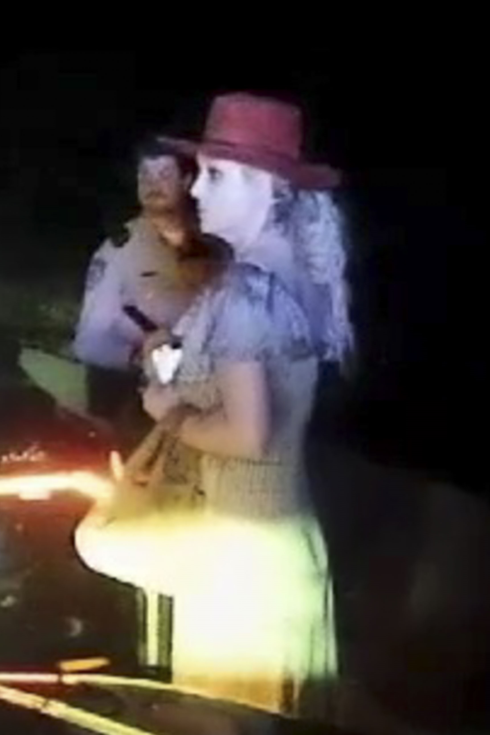 Britney Spears next to a police officer at night during a roadside sobriety test in March 2026.