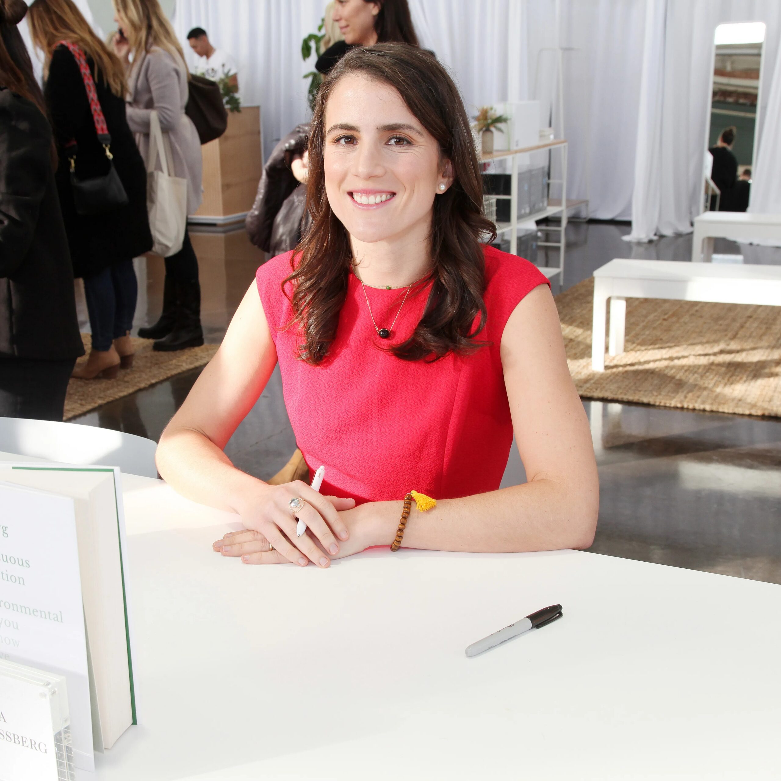 Tatiana Schlossberg smiling at her book signing for "Inconspicuous Consumption." - GC Images