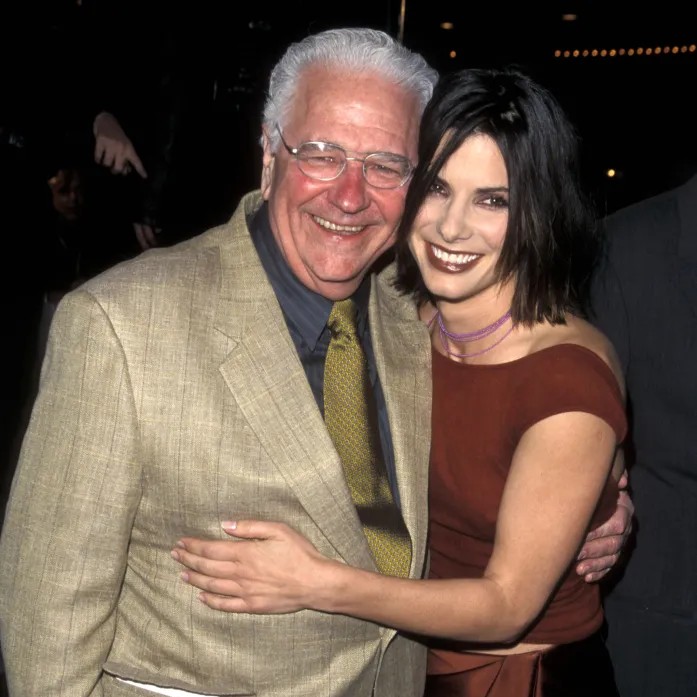 She also shared a happy pic of them posing together at the "Forces of Nature" Los Angeles premiere in March 1999. - Ron Galella Collection via Getty Images