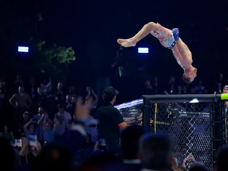 Justin Gaethje celebrates with a backflip inside the Octagon at UFC Freedom 250